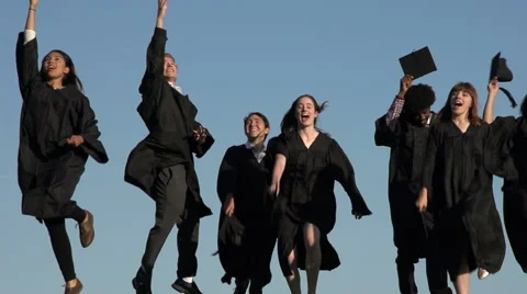 Racially-diverse students throw mortarboards, which fall - slow motion Video stock 44112591