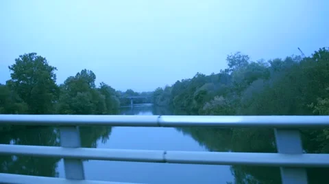 Racing Across Bridge over River on Foggy Day Stock Footage 46645095