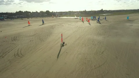 Racing on Blokarts by the ocean Stock Footage 152942271