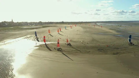 Racing on Blokarts by the ocean Stock Footage 152942328