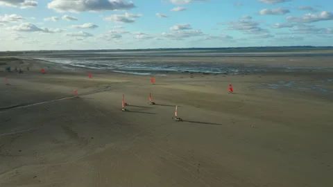 Racing on Blokarts by the ocean Stock Footage 152942551