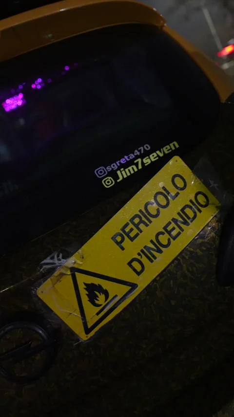 Racing car fire hazard warning sticker on a carbon fiber hood Stock Footage 333562712