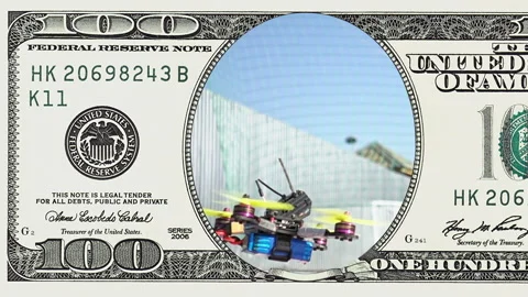 Racing drone taking off in frame of 100 dollar Stock Footage 96725010