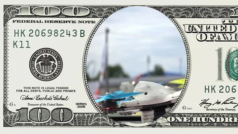 Racing drone taking off in frame of 100 dollar Stock-Footage 97600431