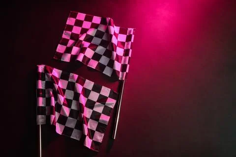 Racing flags on dark pink background Stock Photos