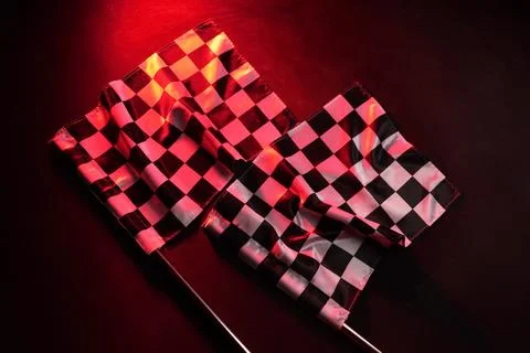 Racing flags on dark red background Stock Photos