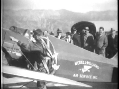 Racing pilot James Robert Wedell flies and wins a trophy in an air show in 1934. Stock Footage
