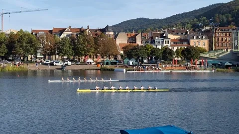 Racing Rowing Boats Competing on the Neckar River in Heidelberg, Germany Stock Footage 346094396