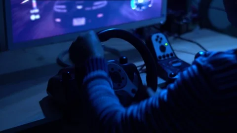 Racing Seat Simulator Cockpit with Steering Wheel and Playing in Car Racing Vidéo 101871822
