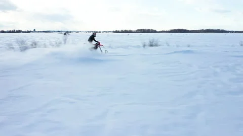Racing through the snow on a timbersled Stock Footage 151046343