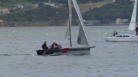 Racing yachts pass a small lighthouse 스톡 동영상 4909202