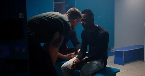 Racist bullying in locker room Stock Footage 123491386