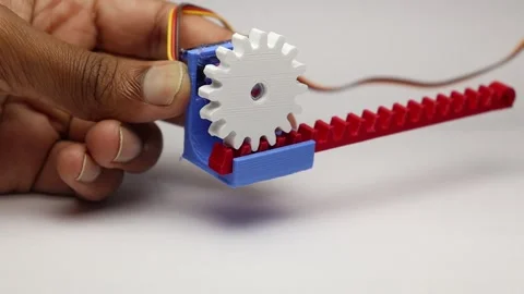 Rack and pinion working shown in close up view. 3D printed mechanisms working Stock Footage 334123302