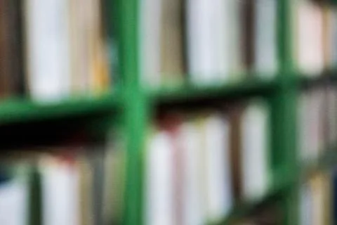 Rack of books, blurry background, texture Stock Photos