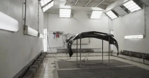 Rack with bumper in painting workshop Stock Footage 227173031