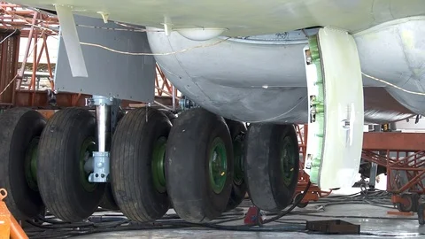 Rack chassis  IL-76 aircraft move up into niches in fuselage. Stock Footage 108802435