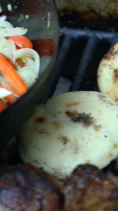 A rack of chicken is being cooked on a grill Stock Footage 275422857