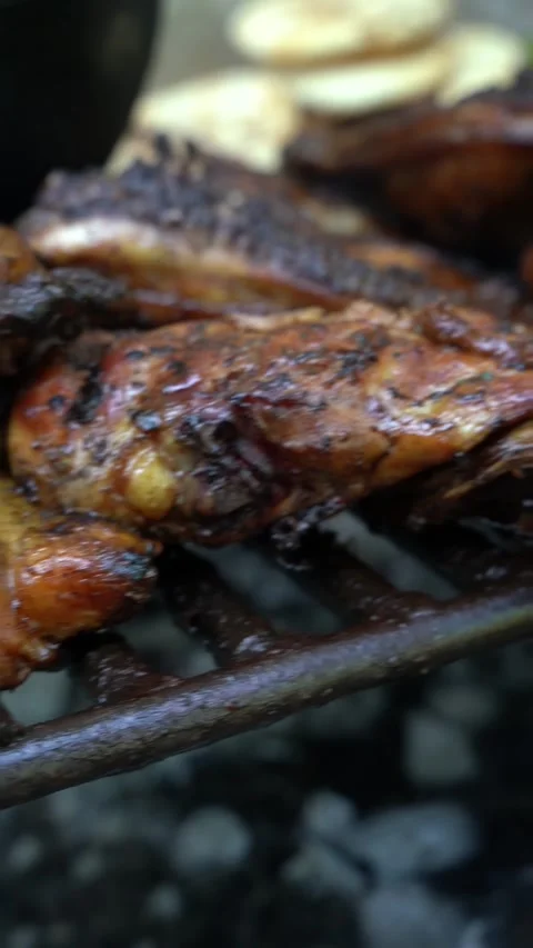 A rack of chicken is being cooked on a grill Stock Footage 275422858