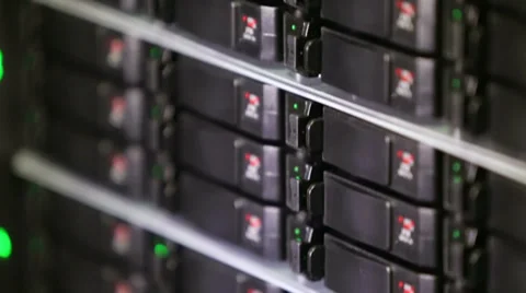 Rack of data server with many hard drives and LED lamps flashes Video stock 31209384