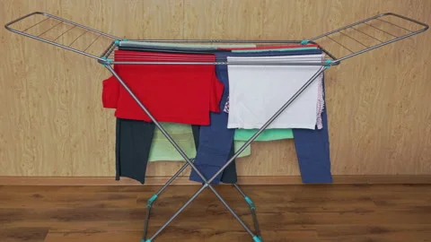 Rack dryer with clothes. Time-lapse Stock Footage 121342094