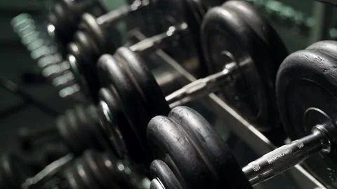 Rack with dumbbells in the gym. Stock Footage 145183815