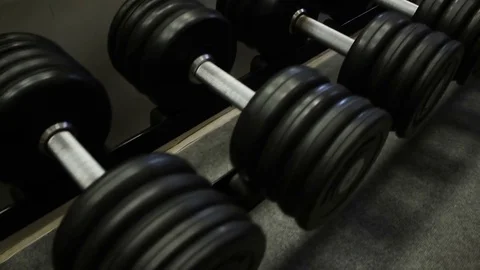 Rack with a dumbbells In training gym Stock Footage 70312631