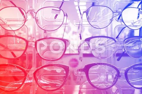 The rack with fashion eyeglasses in the optic store Stock Photos