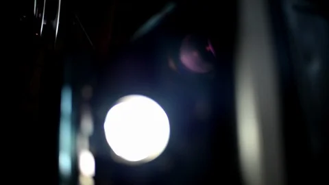 Rack focus 16mm projector with floating dust motes and lens flare Stock Footage 102528978