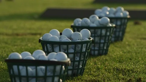 Rack Focus Across Buckets of Balls at the Driving Range Stock Footage 108398415