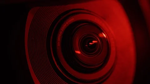 Rack focus across camera lens with police sirens Stock Footage 88977312