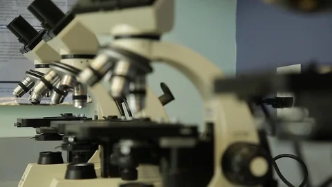 Rack focus across microscopes Stock Footage 91057989