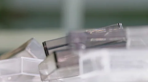 Rack focus across transparent tape cases 4K Stock Footage 49498221