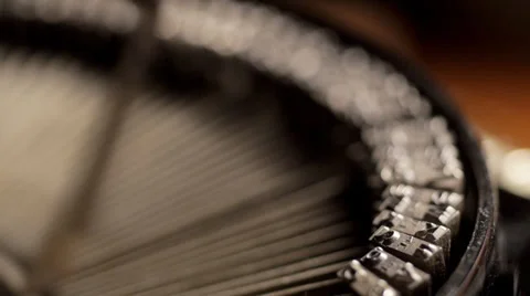 Rack focus across typewriter levers as man types Video stock 33831569