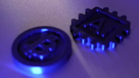 Rack Focus on AI Microchip and Bitcoin Cryptocurrency Coin in Blue Light Видео 348003460