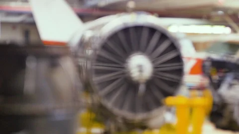 Rack focus of Aircraft turbo engine on display in aircraft maintenance hanger Vídeos de archivo 112671693