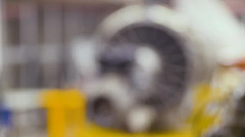 Rack focus of Aircraft turbo engine on display in aircraft maintenance hanger Vídeo Stock 112671972