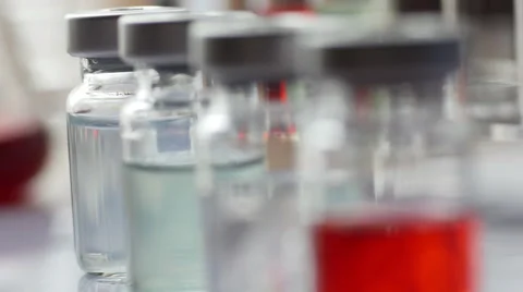 Rack focus along row of injection vials, 4k, UHD Stock Footage 50009048