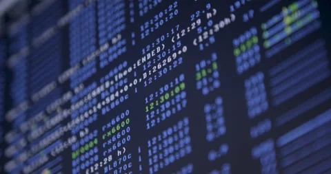 Rack focus and panning across a screen with digital coding and system logs Video stock 261168071