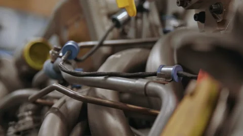Rack focus and slider along an airplane engine being built Video stock 231213618