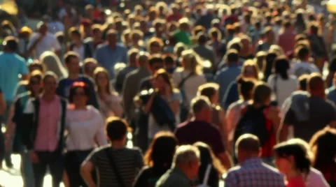 Rack focus anonymous street crowd backlight shot Stock Footage 65138317