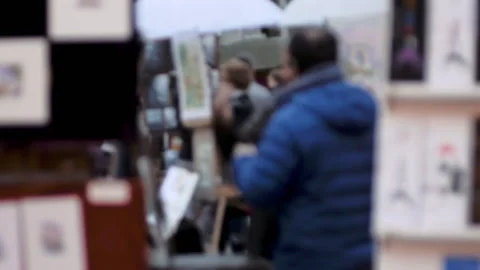 Rack Focus Artists Talking in the Art Market of Place du Tertre Paris Stock Footage 136357257
