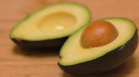 Rack Focus of Avocado on a Bamboo Cutting Board Stock Footage 62748356