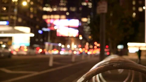 Rack Focus From Bicycle Rack to Downtown Los Angeles Night Traffic Vídeos de archivo 300048058