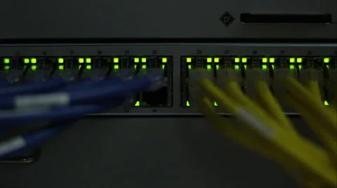 Rack focus of blinking lights in on server Stock Footage 64493492