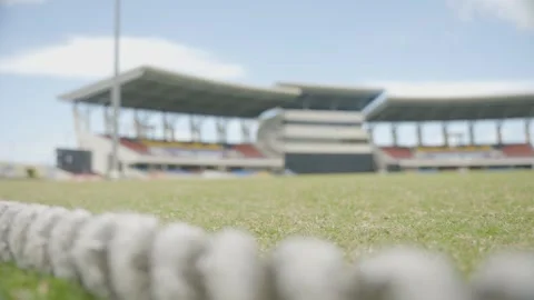 Rack focus from the boundary rope at cricket ground, Viv Richards Stadium Stock Footage 285144315