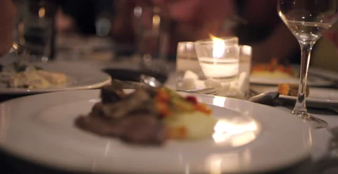 Rack focus candle to white plate ￼steak, mushrooms, mashed potatoes, vegetables￼ 스톡 동영상 202260662