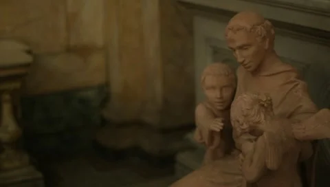 Rack focus to Catholic statue saint rita of cascia with children Stock-Footage 11142639