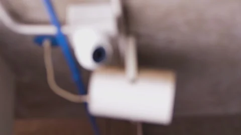 Rack focus of CCTV camera installed on concrete ceiling Stock-Footage 112672125