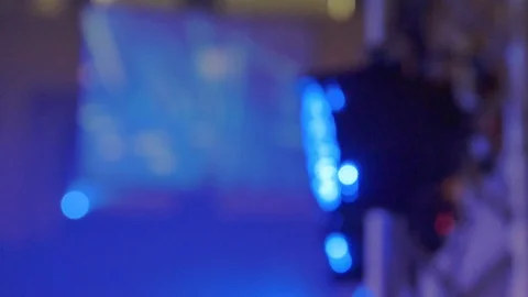 Rack focus close up of colorful spotlight changing color during festival Video stock 113133038