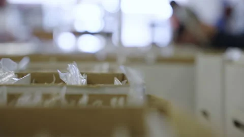 Rack focus close up people reading comic books store boxes slow motion 4K Stock Footage 171974116